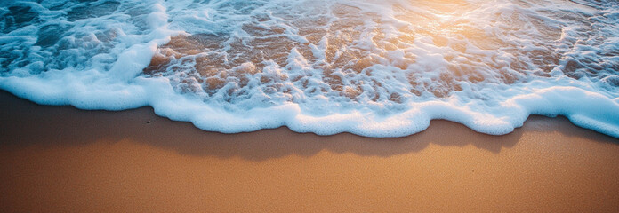 Fototapeta premium A beautiful ocean in light color and fluffy golden sand