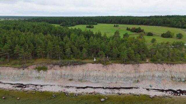 Aerial Video Panga Coastal Cliff and Lighthouse, Northern Shore of Saaremaa Island Near Kuressaare, Baltic Sea. Saaremaa, Estonia. 4K Panoramic Aerial Video of The Panga Cliffs