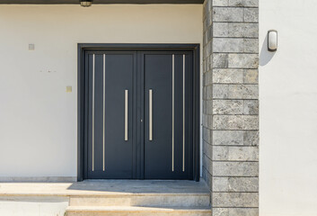 Front porch of house with front door open