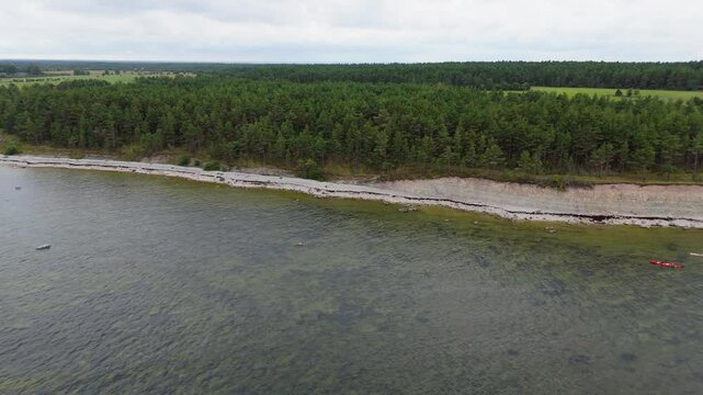 Aerial Video Panga Coastal Cliff and Lighthouse, Northern Shore of Saaremaa Island Near Kuressaare, Baltic Sea. Saaremaa, Estonia. 4K Panoramic Aerial Video of The Panga Cliffs