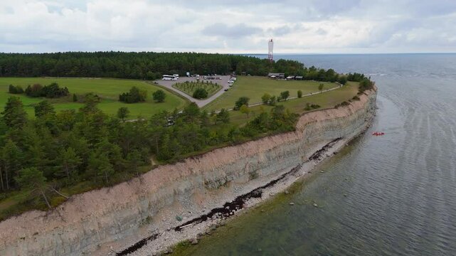 Aerial Video Panga Coastal Cliff and Lighthouse, Northern Shore of Saaremaa Island Near Kuressaare, Baltic Sea. Saaremaa, Estonia. 4K Panoramic Aerial Video of The Panga Cliffs