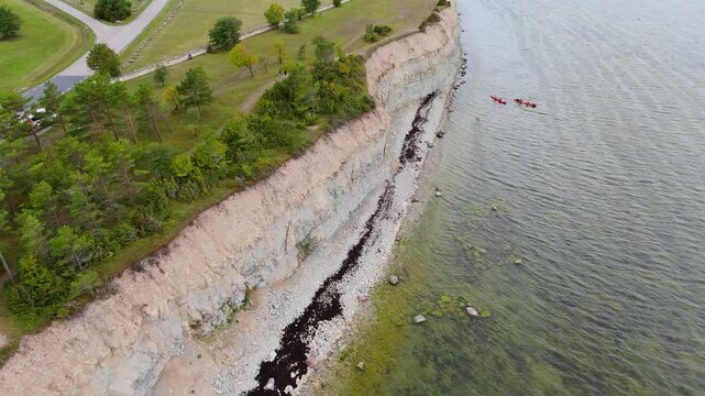 Aerial Video Panga Coastal Cliff and Lighthouse, Northern Shore of Saaremaa Island Near Kuressaare, Baltic Sea. Saaremaa, Estonia. 4K Panoramic Aerial Video of The Panga Cliffs