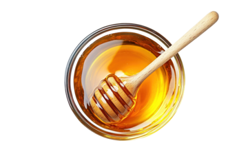 Glass bowl of pure honey with honey dipper isolated on a transparent background. cut out in PNG format for graphic design, isolated on a white background. top view.