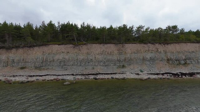 Aerial Video Panga Coastal Cliff and Lighthouse, Northern Shore of Saaremaa Island Near Kuressaare, Baltic Sea. Saaremaa, Estonia. 4K Panoramic Aerial Video of The Panga Cliffs