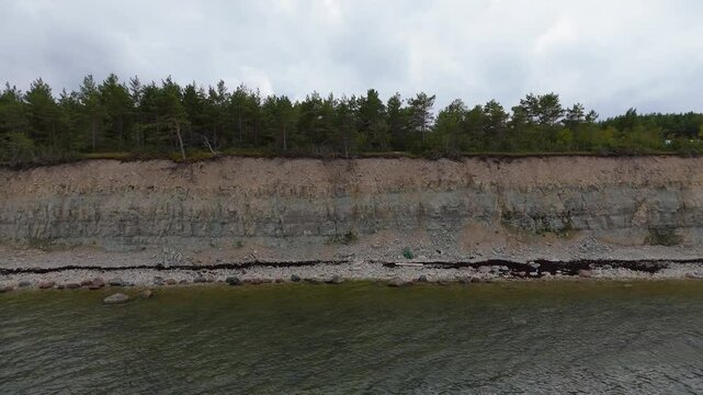 Aerial Video Panga Coastal Cliff and Lighthouse, Northern Shore of Saaremaa Island Near Kuressaare, Baltic Sea. Saaremaa, Estonia. 4K Panoramic Aerial Video of The Panga Cliffs