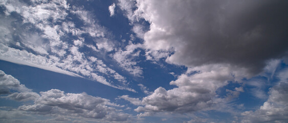 Spring blue sky cloud gradient background. Cloudy sky. Vivid cyan blue landscape in environment day horizon skyline view. White clouds on soft sky background. White cloudy sky.