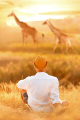 Tourist dreams with wild giraffes. Safari in wild Africa. Fantastic summer image. Imagination image.