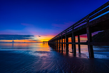 Fototapeta premium Sunrise view at the sea pier bridge