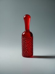 Simple close-up of a striking red object on a plain background.