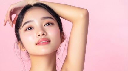 Obraz premium Young Woman with Clear Skin Smiling on Pink Background.