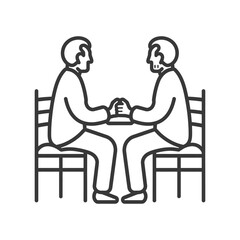 Two People Sitting Opposite Each Other Holding Hands