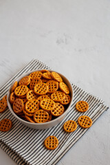 Organic Dry Waffle Pretzels in a Bowl, side view. Copy space.