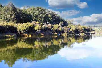 Fototapeta premium Tranquil morning sunrise mood at the Lake Te Anau with reflections in the water, Fiordland, South Island, New Zealand