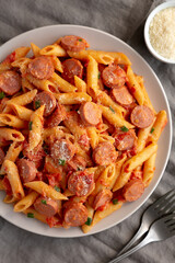 Homemade One-Pot Hot Dog Pasta on a Plate, top view. Flat lay, from above.