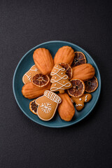 French classic madeleine sponge cake with elements of Christmas motifs