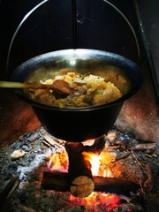 Cabbage in cooking kettle. Prepares traditional food cabbages with meat