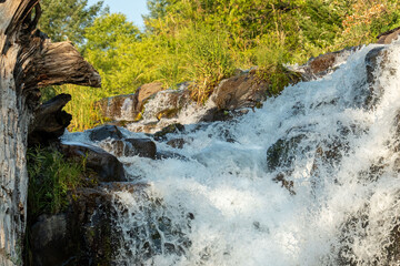 playing in a waterfall