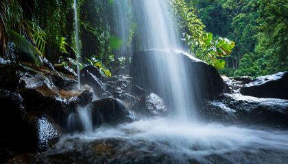 Obraz premium Waterfall Details- Macro View of Water Cascading Over a Small Waterfall