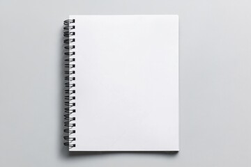Blank spiral notebook on a light grey surface for creative projects and note-taking