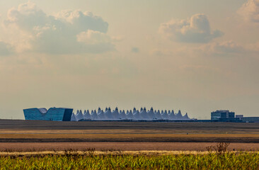 Denver International Airport in the distance against the afternoon sky