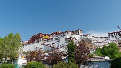 Potala Palace in Lhasa, Tibet under a clear blue sky.