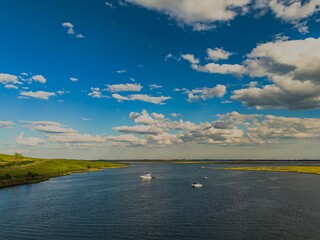 High angle aerial view over Island Park, Long Island, New York on a sunny day with blue skies