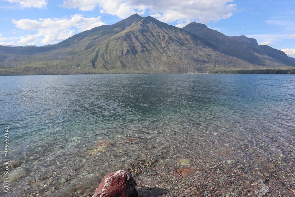 Wall mural mountain range reflecting in clear lake waters