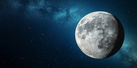 Fototapeta premium The moon in space with a starry background, showing detailed lunar surface features illuminated by soft light, floating against a deep blue sky, selective focus