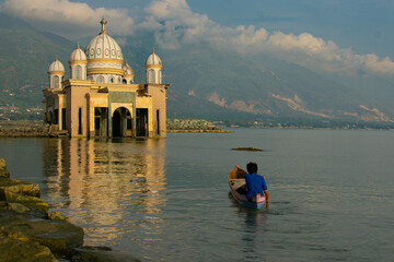 Fishing activity near the floating mosque palu, Central Sulawesi, Indonesia.