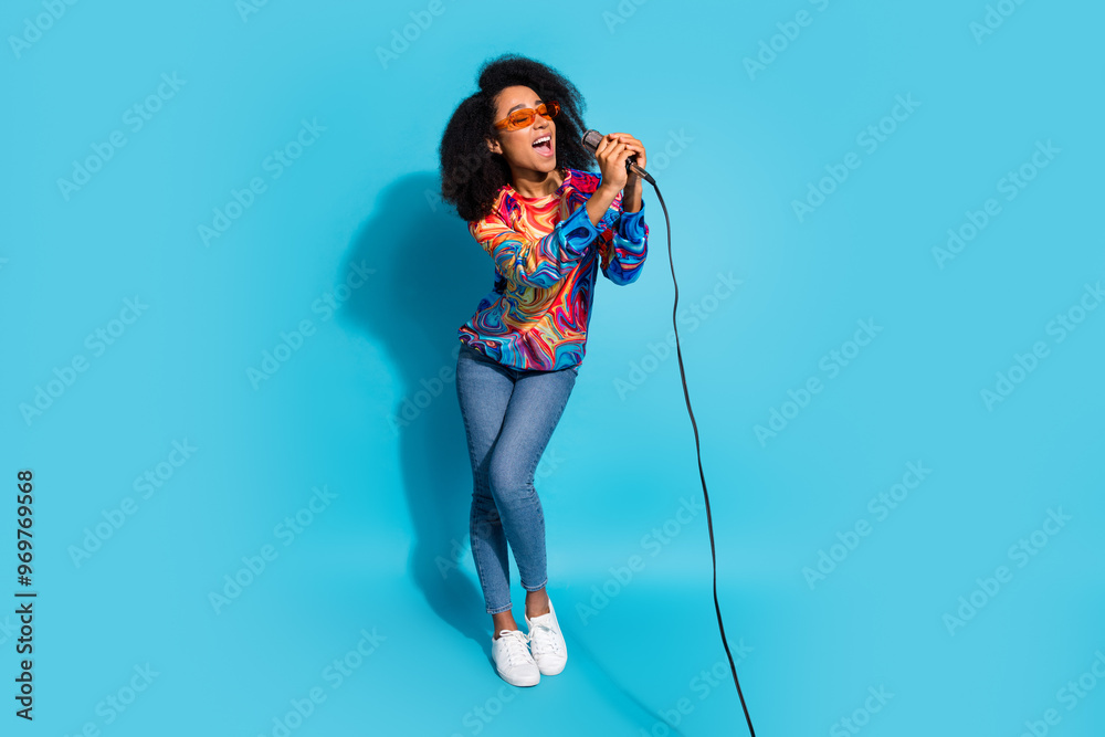 Canvas Prints Full length photo of lovely young lady have fun sing karaoke dressed stylish colorful garment isolated on blue color background