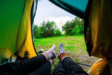 A first-person view of the mountains from the tent of a couple of tourists © kosmos111
