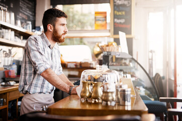 Fototapeta premium Thinking, barista or man by counter in cafe, customer service and cashier working in coffee shop. Bistro startup, small business and male owner with thoughts for store management, serving and manager