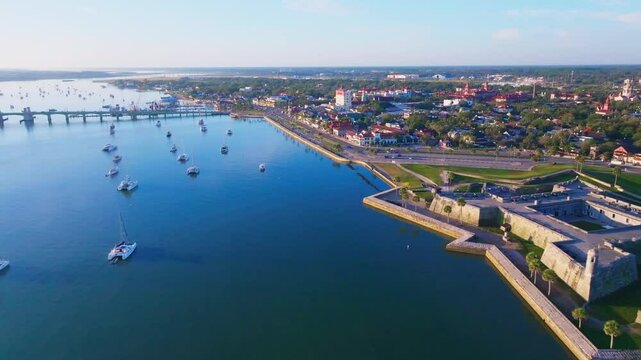 Aerial fly in to city of St. Augustine, Florida over river
