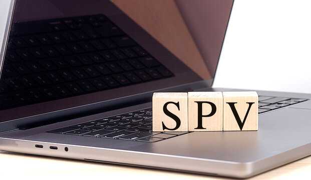 SPV -Special Purpose Vehicle concept with wooden blocks on laptop keyboard
