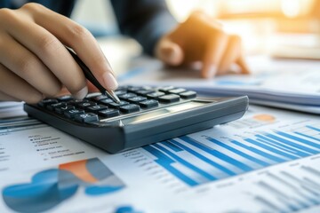 A business person using a calculator on a table with documents and graphs Generative AI