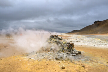 Hverir, Iceland - 24 August 2024: Steaming fumarole at the hot springs around the geothermal area of Hverir