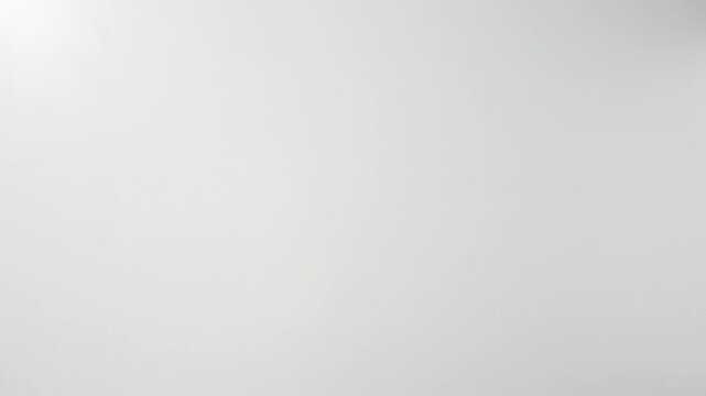 Overhead shot of hands giving and taking a cardboard box, package on white background.