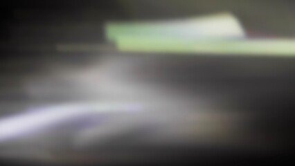 Cinematic anamorphic lens flares with vivid light streaks and reflections against a black background, creating a dynamic and glowing optical effect.