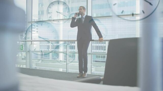 Businessman talking on phone with multiple clocks animation over office background