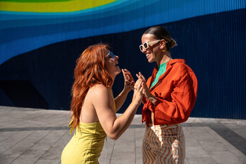 Joyful lesbian couple enjoying a sunny day outdoors
