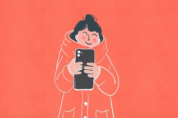 Young woman enjoys using her smartphone in winter attire