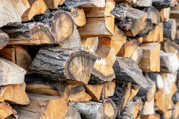 stacked firewood for burning in the fireplace, firewood texture