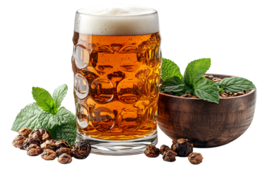 a glass of beer next to a bowl of nuts and leaves. 