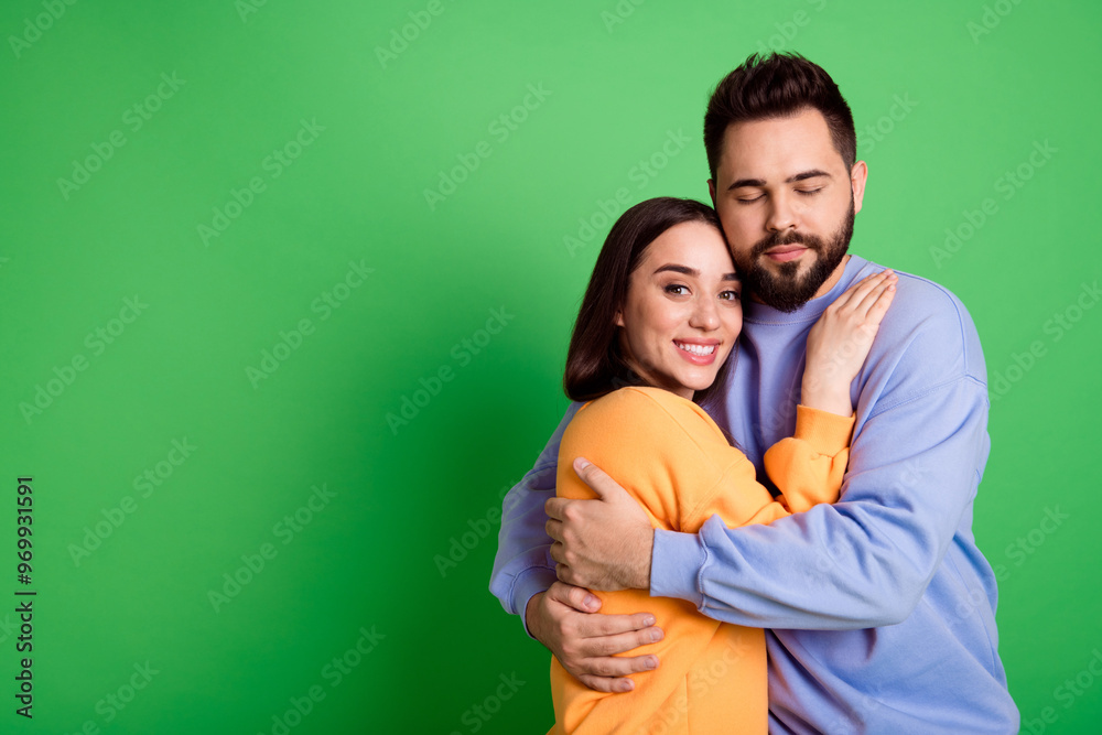 Sticker Photo of charming lovely cute couple wear stylish clothes empty space isolated on green color background