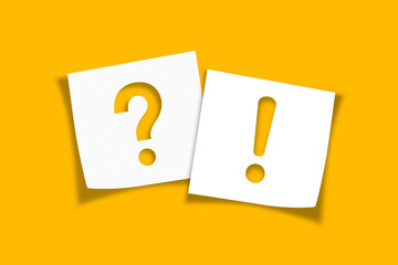 Note paper with exclamation mark and question mark on yellow background