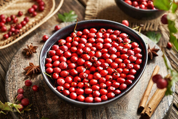 Preparation of medicinal wine from fresh hawthorn berries harvested in autumn, cinnamon and star anise
