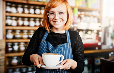 Portrait, happy woman and barista serve coffee in shop for customer service, hospitality and order. Face, smile and waitress giving cup in cafe to offer latte, espresso and drink in small business - Powered by Adobe