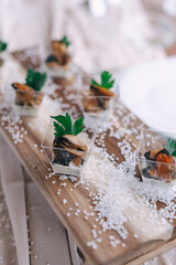 Gourmet Appetizers on Rustic Wooden Board