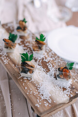 Gourmet Appetizers on Rustic Wooden Board