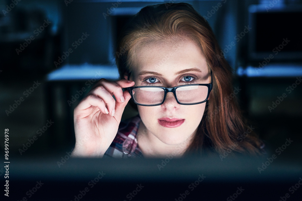 Poster Portrait, woman and glasses at night on computer at office with deadline, overtime and project as software developer. Employee, face and female person with programming and application design
